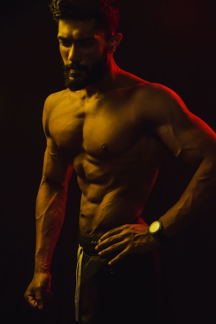 Man under dramatic red and gold lighting